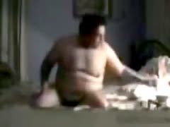 A brunette with kinky, rather hefty hair The wifey licked the rock-hard pecker of her heavy husband.